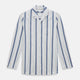 The Turnbull & Asser Blue Blazer Stripe Pyjama Shirt features a collar, chest pocket, and vertical blue, white, and light red stripes—an elegant long-sleeve loungewear piece neatly displayed on a plain white background.