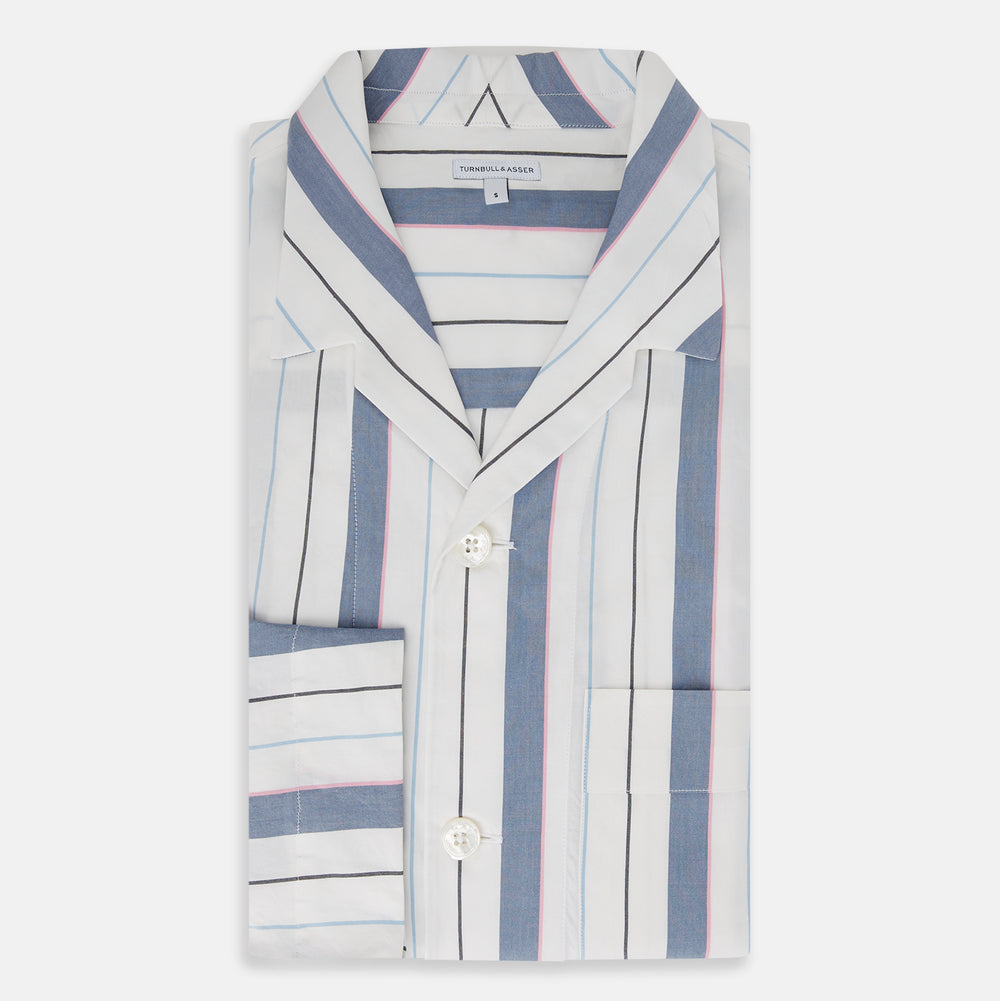 The Turnbull & Asser Blue Blazer Stripe Pyjama Shirt features a collar, chest pocket, and vertical blue, white, and light red stripes—an elegant long-sleeve loungewear piece neatly displayed on a plain white background.