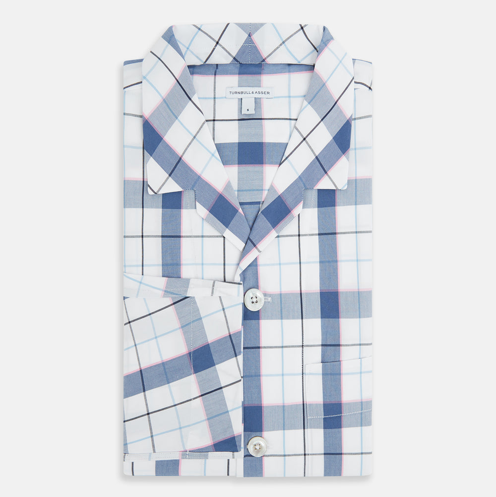 The Turnbull & Asser Blue Blazer Check Pyjama Shirt features long sleeves, a classic collar, and white buttons in a blue and white plaid, offering elegant loungewear style.