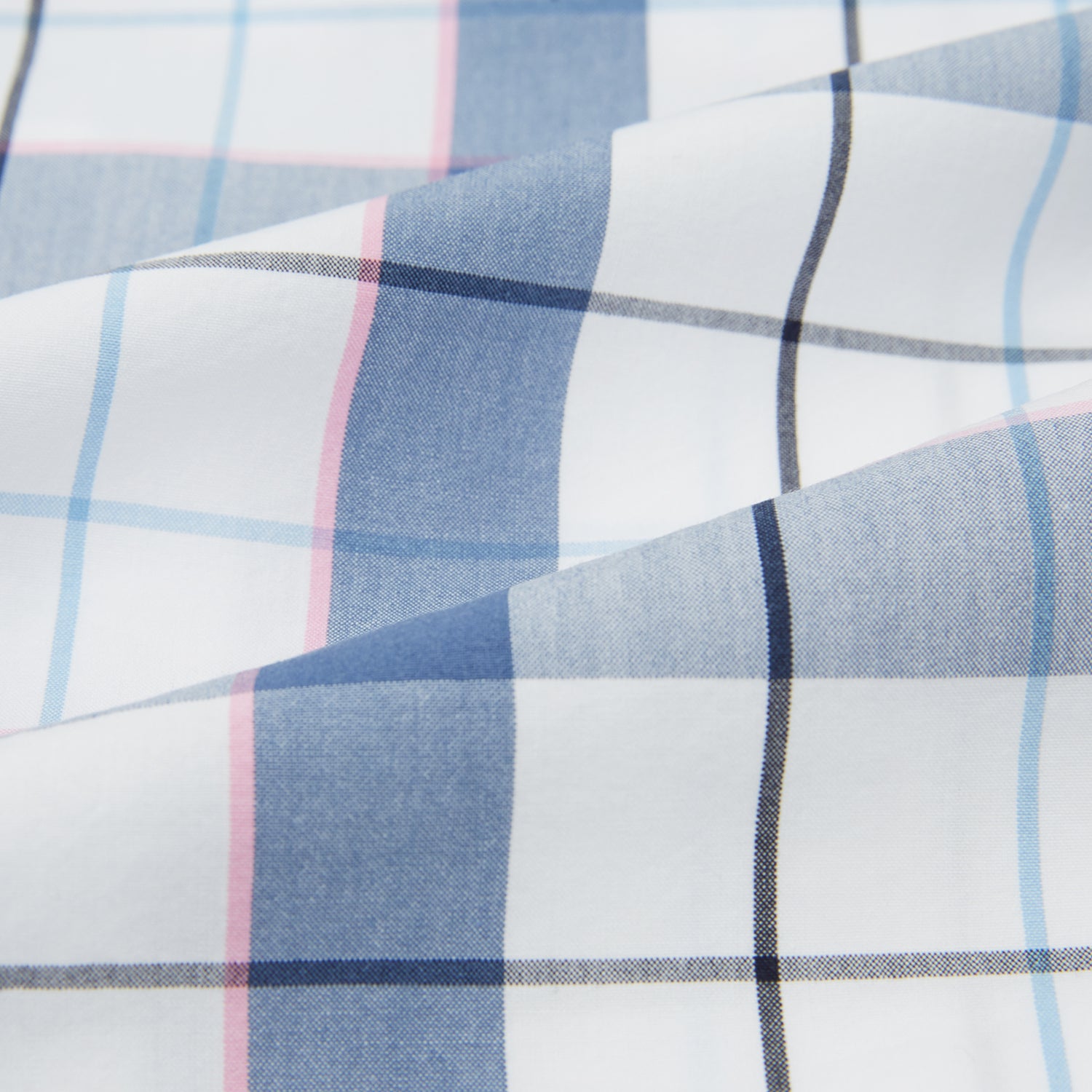View 6 of product The Turnbull & Asser Blue Blazer Check Pyjama Shirt features long sleeves, a classic collar, and white buttons in a blue and white plaid, offering elegant loungewear style.