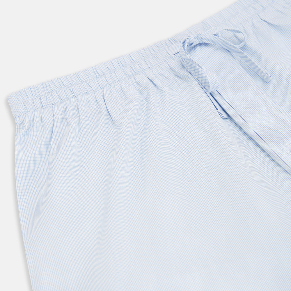 Turnbull & Asser’s Pale Blue Micro Check Pyjama Trousers feature an elastic waistband with drawstring for comfort, making these light blue sleepwear pants ideal for relaxing and sleeping.
