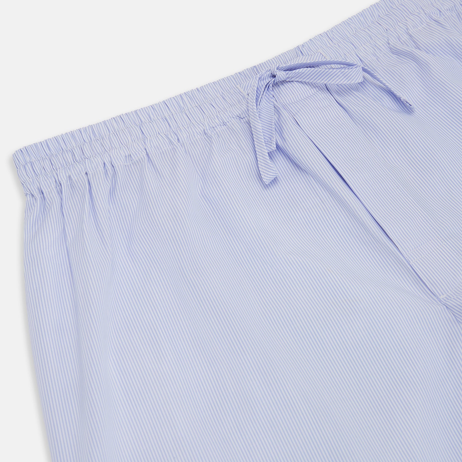 View 2 of product Turnbull & Asser Pale Blue Fine Stripe Pyjama Trousers with elastic waistband and drawstring, shown flat against a white background.