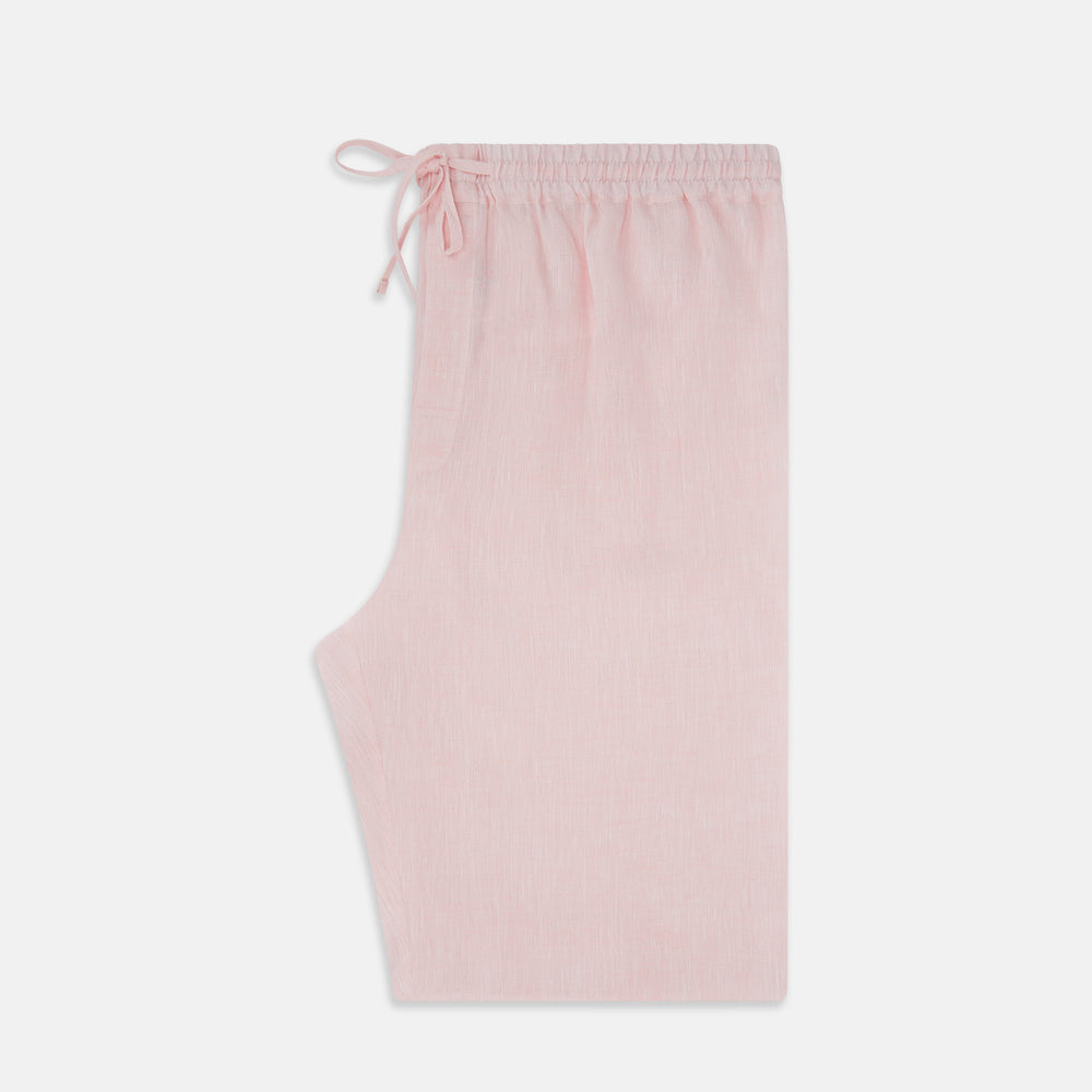 The Turnbull & Asser Pale Pink Linen Pyjama Trousers feature an elastic waistband and drawstring, combining comfort and style. Displayed flat on a plain white background, these trousers are perfect sleepwear.