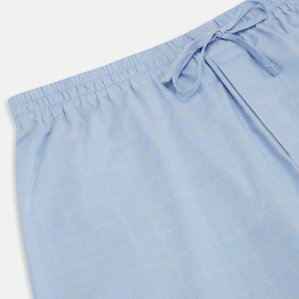 The Blue Prince of Wales Check Pyjama Trousers by Turnbull & Asser, featuring a subtle check pattern, elastic waistband, and drawstring tie, are laid flat on a white background.