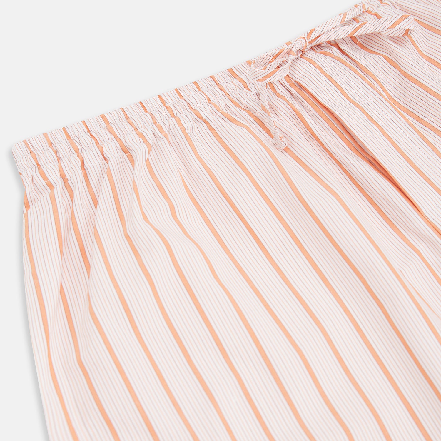 View 2 of product Turnbull & Asser's Orange Multi Track Stripe Pyjama Trousers feature vertical stripes, an elastic waistband, and a drawstring tie—ideal for comfort lovers. Displayed flat on a plain white background.
