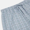 View 2 of product Turnbull & Asser’s Blue and Green Multi Track Check Pyjama Trousers feature an elastic waistband with drawstring and a blue-green check pattern on a white background, shown laid flat on a white surface.