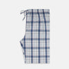 View 4 of product The Blue Blazer Check Pyjama Trousers by Turnbull & Asser feature a straight-leg fit, elastic waistband with drawstring, and white, blue, and gray plaid pattern. Comfortable with side pockets, they are shown laid flat against a white background.
