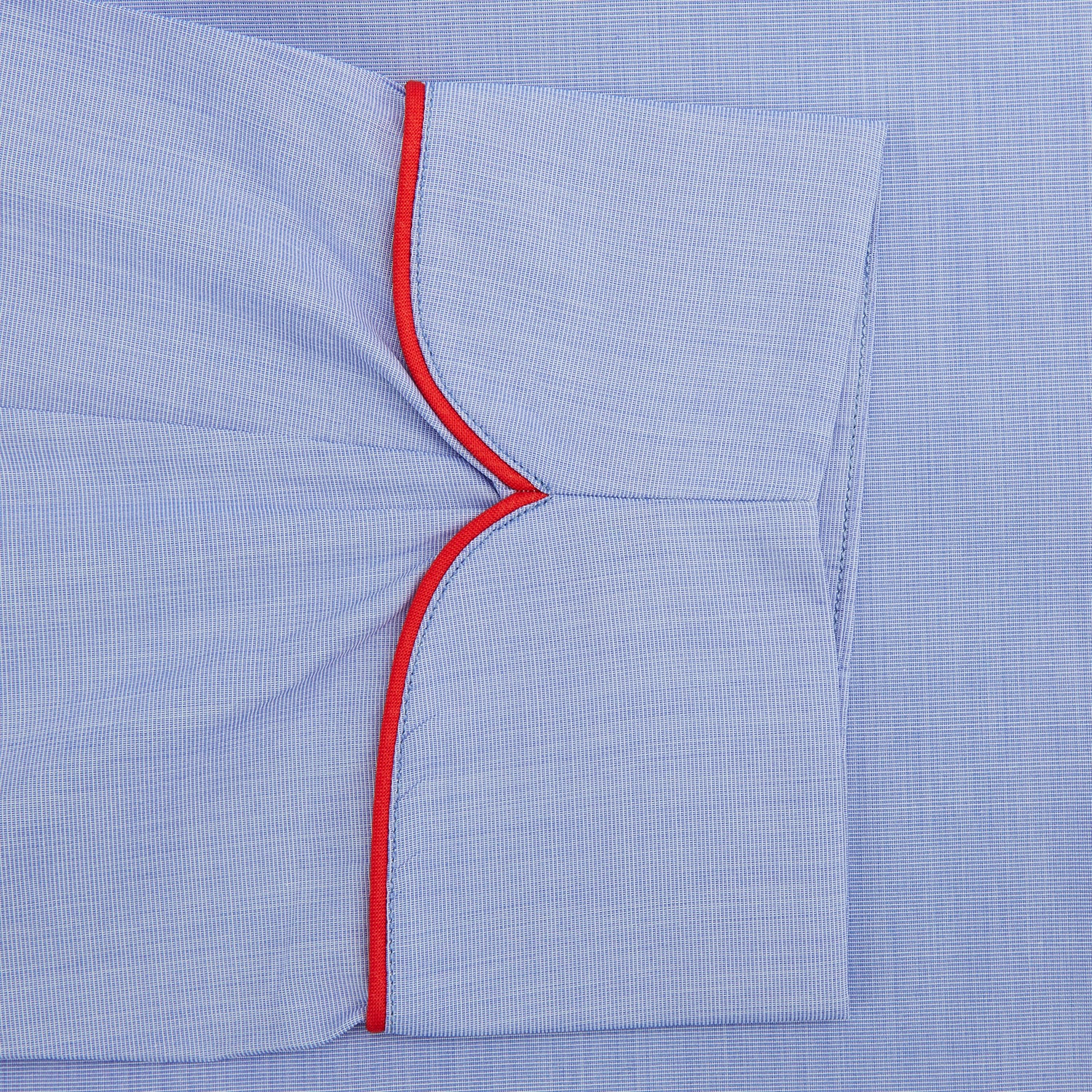 View 3 of product The Turnbull & Asser Light Blue Piped End-On-End Cotton Gown features a belted waist, three front pockets, and red piping on the collar, pockets, and cuffs—ideal for travel. Displayed against a white background.