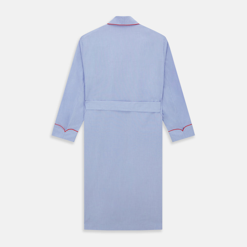 The Turnbull & Asser Light Blue Piped End-On-End Cotton Gown features a belted waist, three front pockets, and red piping on the collar, pockets, and cuffs—ideal for travel. Displayed against a white background.