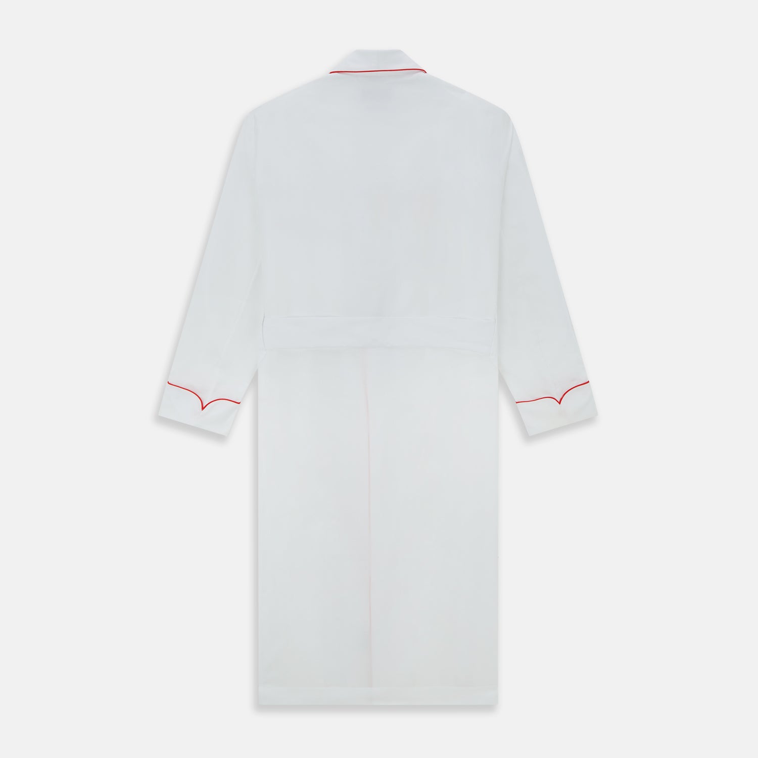 View 4 of product The Turnbull & Asser White Piped Herringbone Cotton Gown features long sleeves, a waist tie, chest pocket, and striking red piping on the collar, cuffs, pocket, and edges—an elegant piece showcased against a white background.