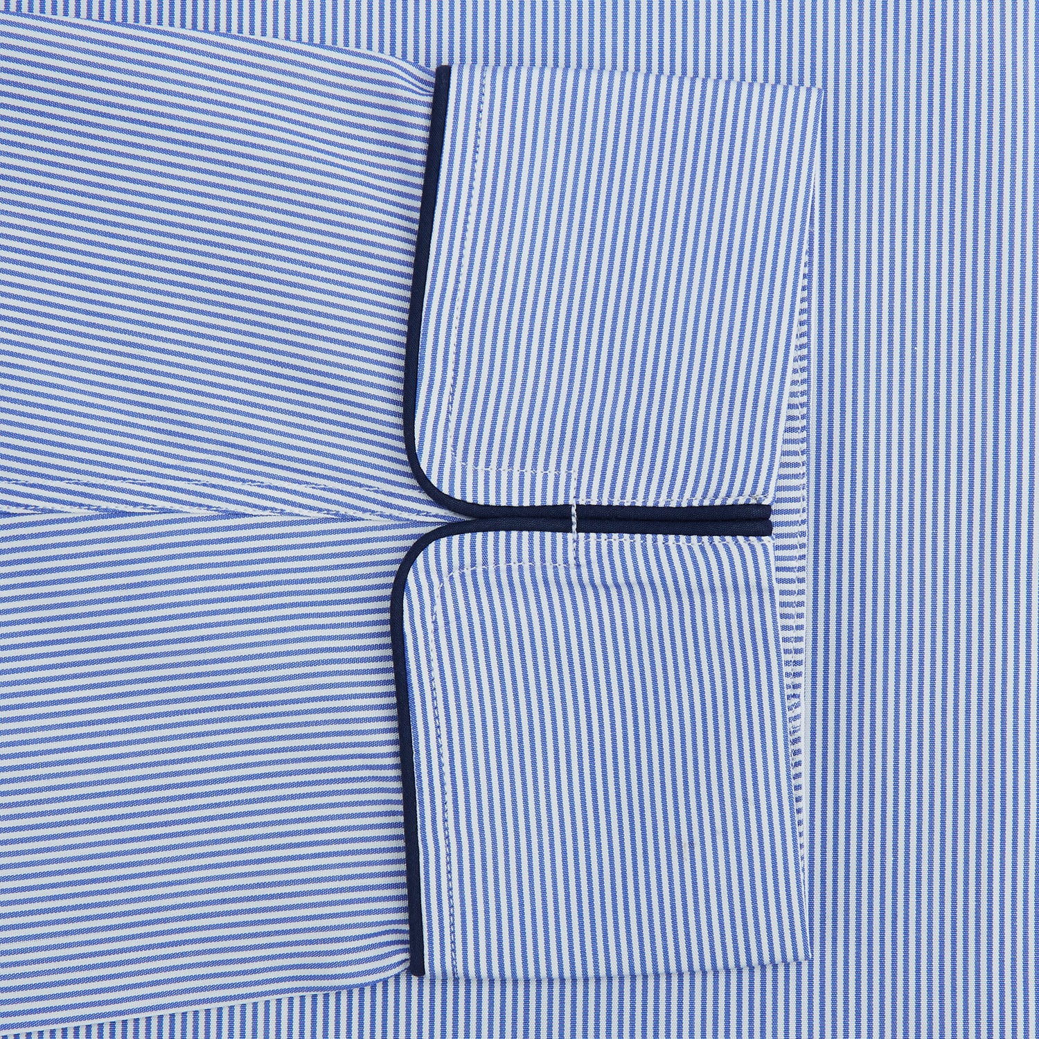 View 3 of product The Blue Fine Bengal Stripe Piped Cotton Gown by Turnbull & Asser features long sleeves, a shawl collar, navy piping, three pockets, and a fabric belt—ideal for those who appreciate classic cotton dressing gowns.