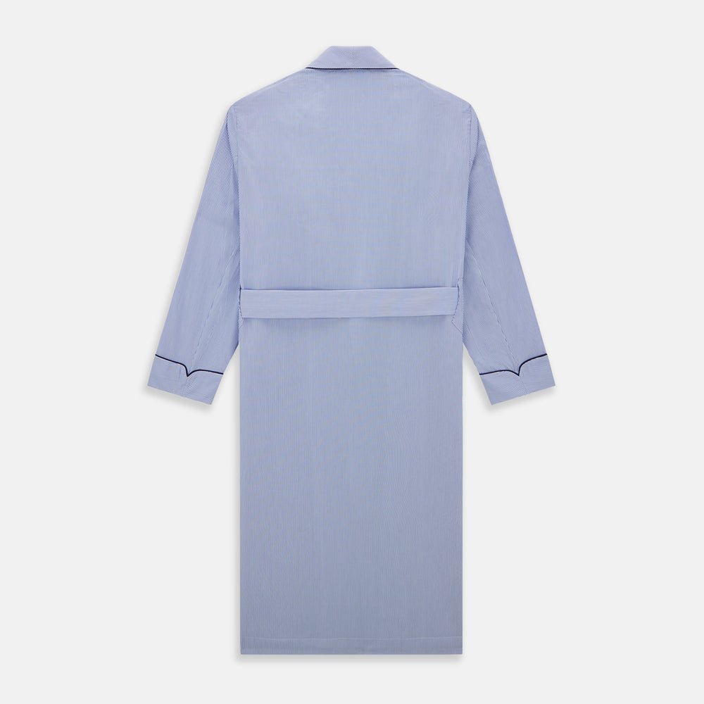 The Blue Fine Bengal Stripe Piped Cotton Gown by Turnbull & Asser features long sleeves, a shawl collar, navy piping, three pockets, and a fabric belt—ideal for those who appreciate classic cotton dressing gowns.