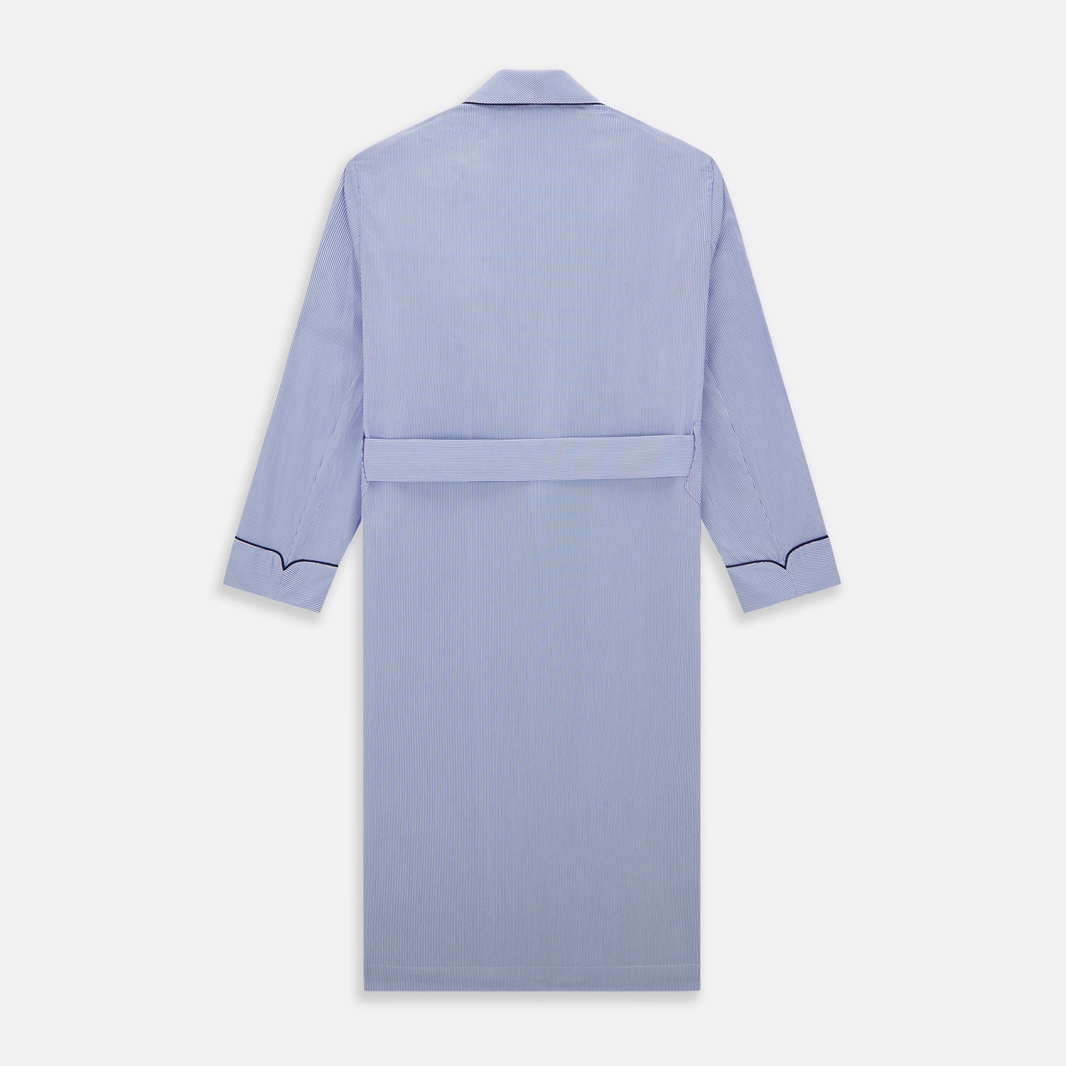 View 4 of product The Blue Fine Bengal Stripe Piped Cotton Gown by Turnbull & Asser features long sleeves, a shawl collar, navy piping, three pockets, and a fabric belt—ideal for those who appreciate classic cotton dressing gowns.