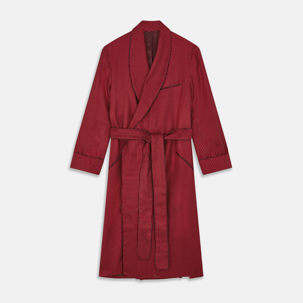 The Turnbull & Asser Burgundy Spot Silk Gown features a shawl collar, front pocket, and matching belt—ideal for relaxation—shown on a white background.