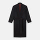 The Navy and Red Piped Cashmere Gown by Turnbull & Asser features a belted navy silhouette with red contrast piping, wide lapels, chest pocket, and two side pockets, shown on a plain white background.