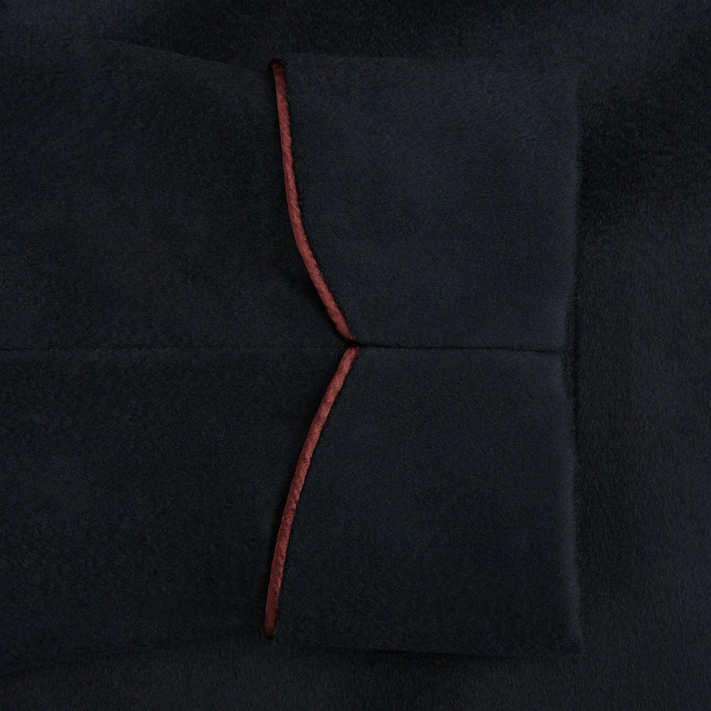 The Navy and Red Piped Cashmere Gown by Turnbull & Asser features a belted navy silhouette with red contrast piping, wide lapels, chest pocket, and two side pockets, shown on a plain white background.