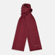 The Plain Wine Silk Scarf by Turnbull & Asser is a long, smooth accessory with subtle fringe and white Turnbull & Asser embroidery on one corner. It comes neatly folded in a deep wine color, perfect for an elegant touch.