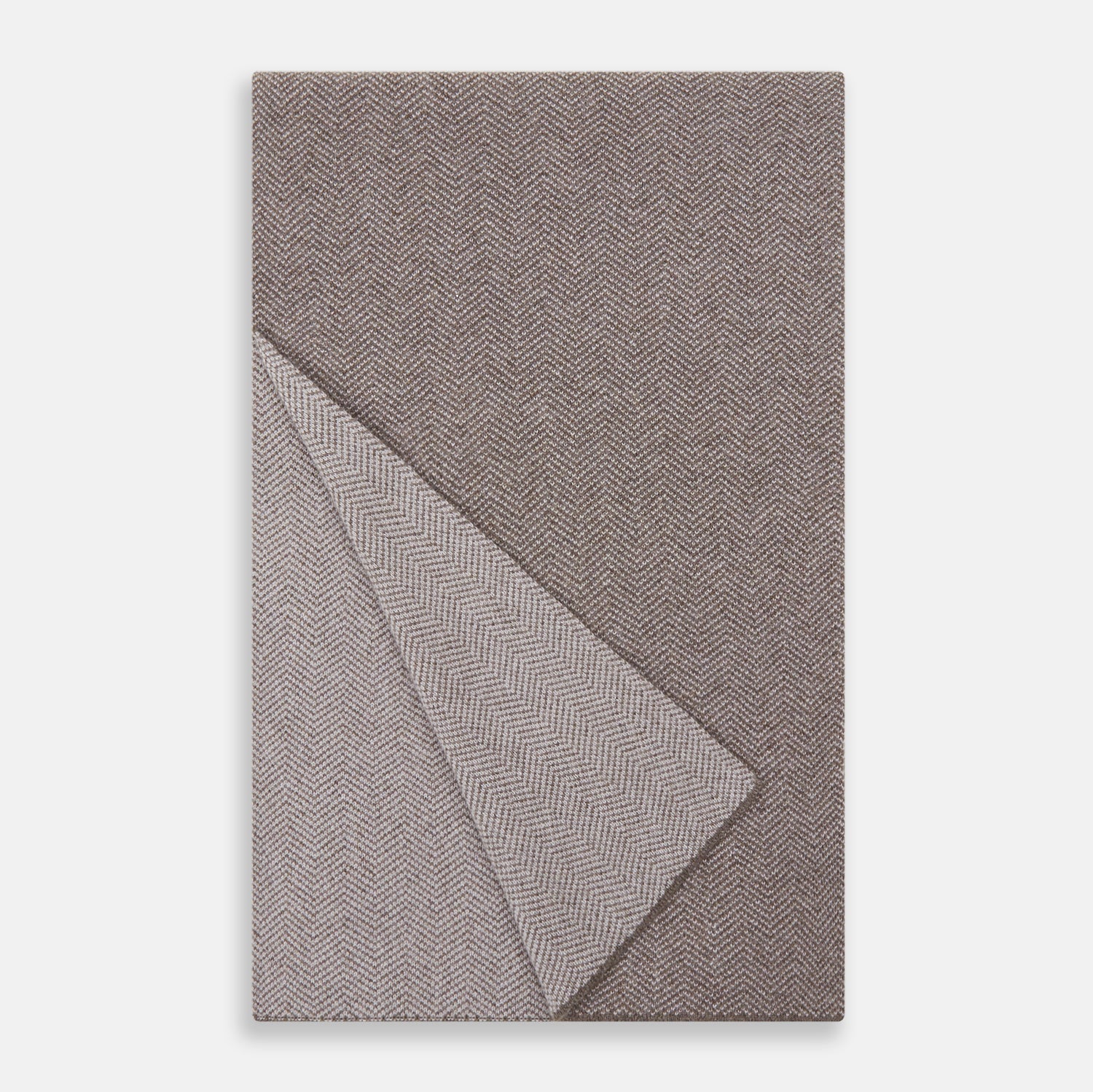 View 2 of product The Turnbull & Asser Reversible Grey Herringbone Cashmere Scarf is artfully folded and displayed on a plain white background.