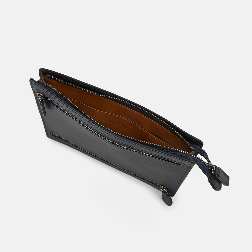 The Turnbull & Asser UK Navy Leather Zip Envelope Pouch, a rectangular travel accessory with two horizontal zippered compartments, is displayed against a plain white background.