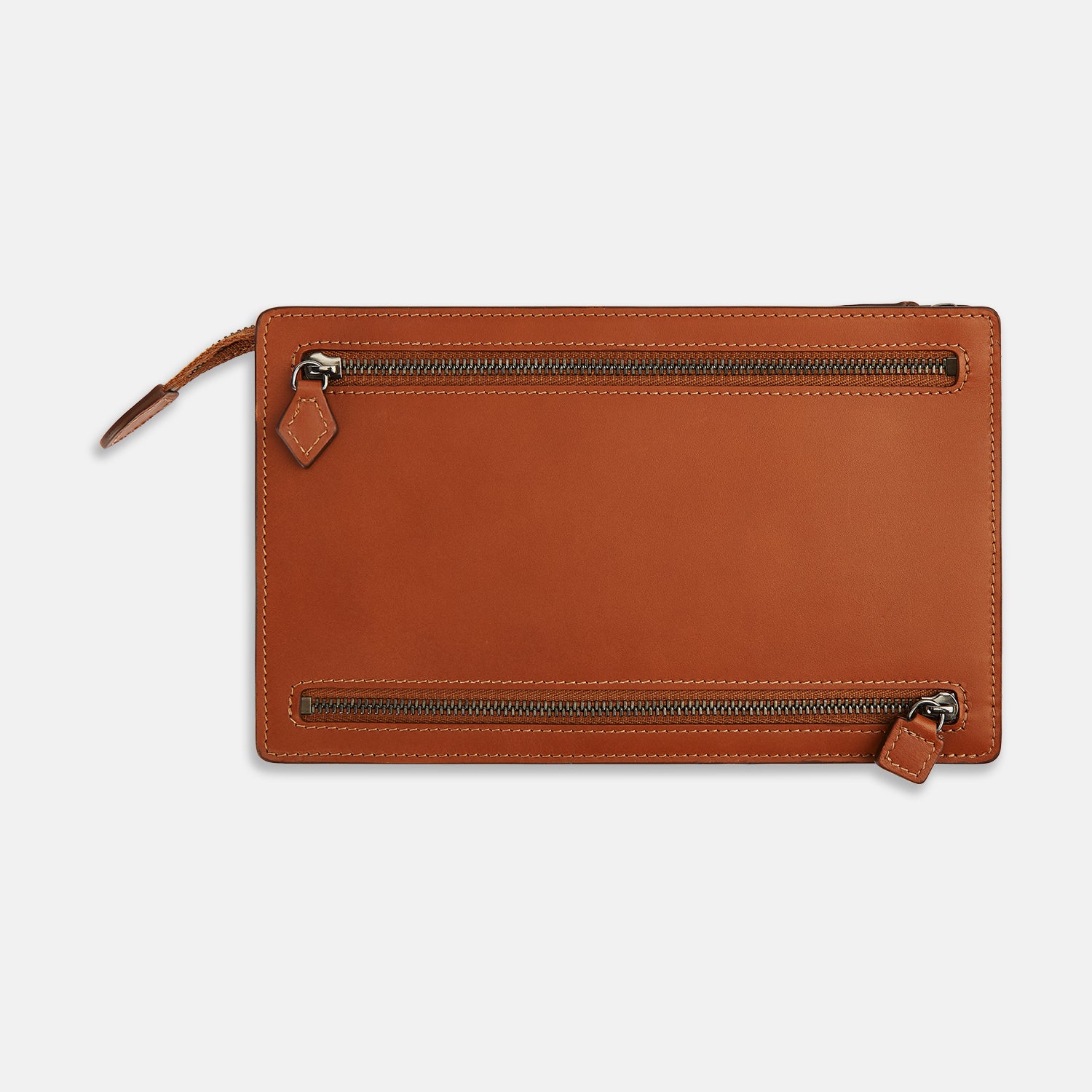 View 1 of product The Cognac Leather Zip Envelope Pouch by Turnbull & Asser UK features two horizontal zippered pockets, stitched edges, and leather pulls—offering a stylish way to organize essentials when you travel.