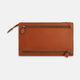 The Cognac Leather Zip Envelope Pouch by Turnbull & Asser UK features two horizontal zippered pockets, stitched edges, and leather pulls—offering a stylish way to organize essentials when you travel.