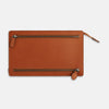View 3 of product The Cognac Leather Zip Envelope Pouch by Turnbull & Asser UK features two horizontal zippered pockets, stitched edges, and leather pulls—offering a stylish way to organize essentials when you travel.