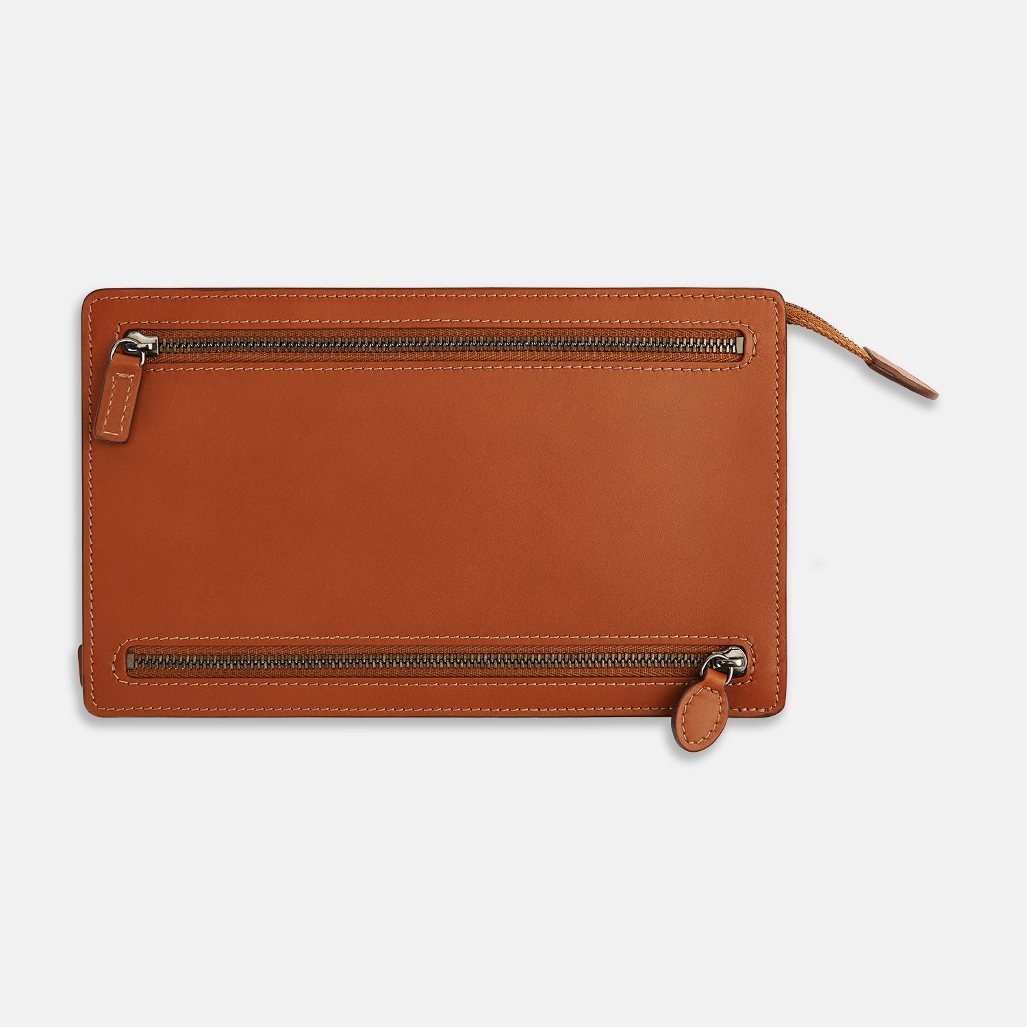 View 3 of product The Cognac Leather Zip Envelope Pouch by Turnbull & Asser UK features two horizontal zippered pockets, stitched edges, and leather pulls—offering a stylish way to organize essentials when you travel.