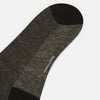 View 3 of product A pair of Turnbull & Asser UK Dark Chocolate Cotton-Linen Mid-Length Socks, featuring a black and gray pattern with black heels, toes, and cuffs, laid flat on a white background.