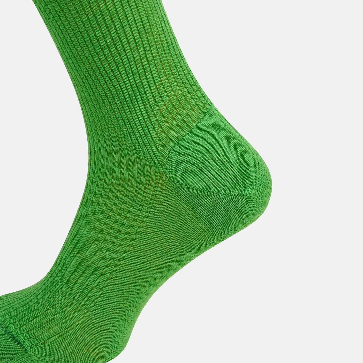 View 4 of product A single Bright Green Mid-Length Merino Sock by Turnbull & Asser is displayed standing with the heel slightly lifted against a plain white background.
