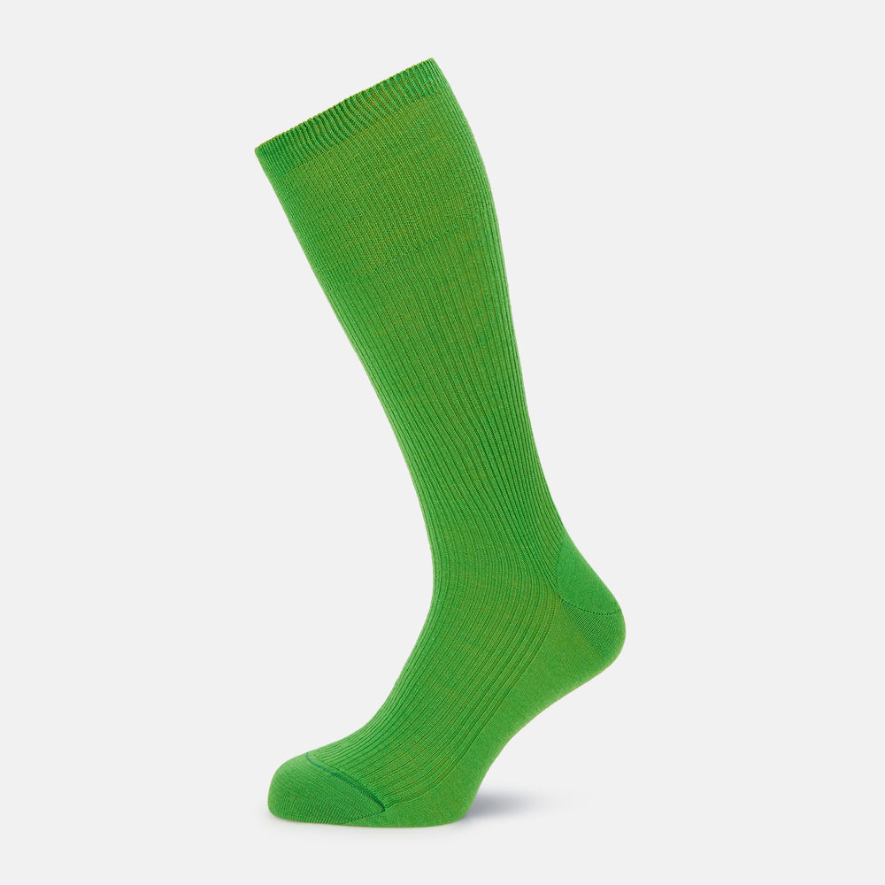 A single Bright Green Mid-Length Merino Sock by Turnbull & Asser is displayed standing with the heel slightly lifted against a plain white background.