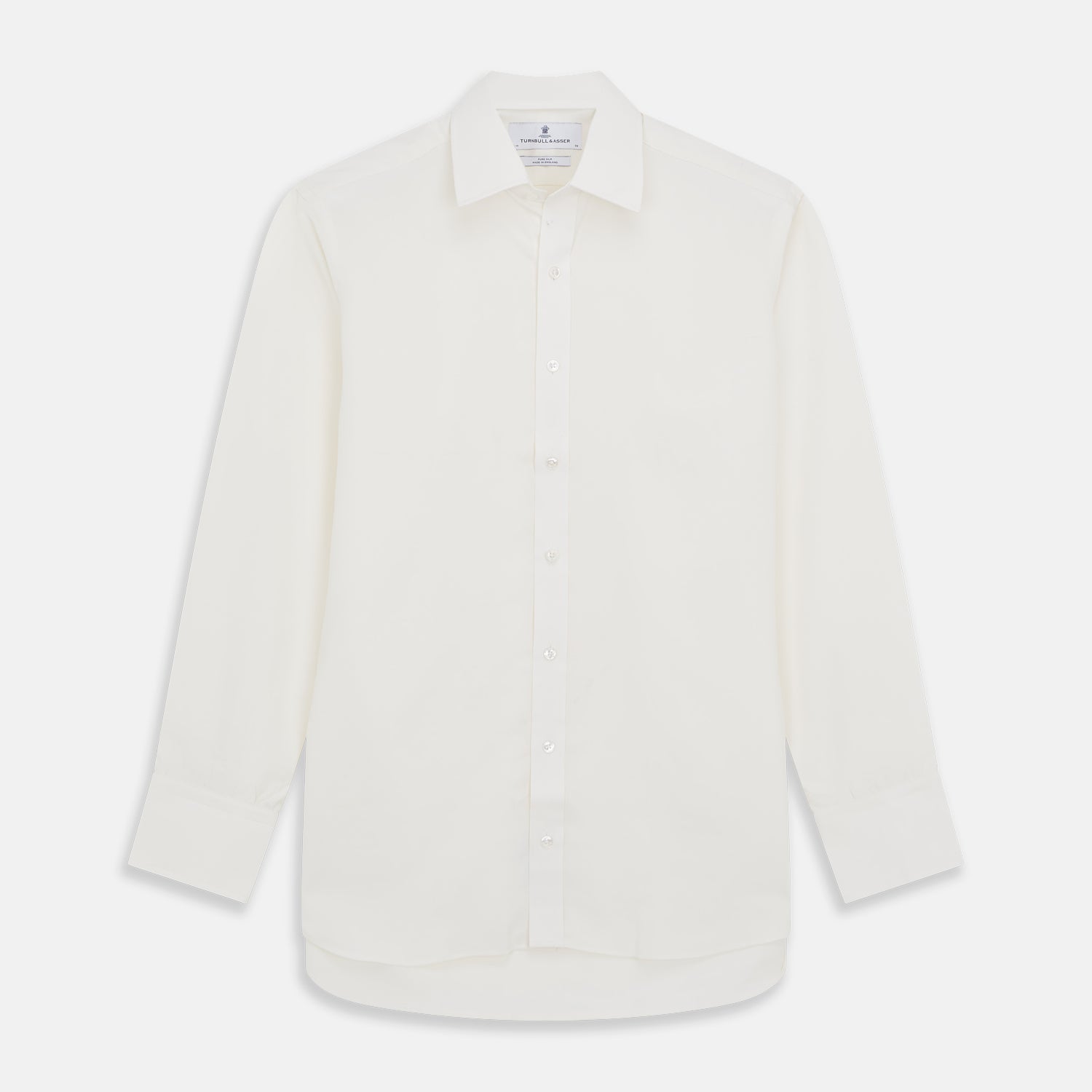 View 1 of product The Turnbull & Asser Cream Silk Mayfair Shirt features long sleeves, a classic collar, button-down front, and buttoned cuffs, shown laid flat on a white background.