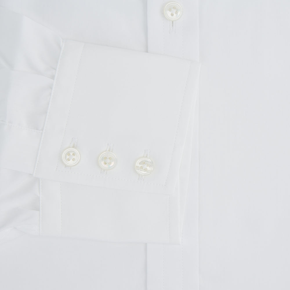 The Turnbull & Asser Plain White Cotton Shirt features a T&A collar, 3-button cuffs, and a timeless minimalist design, shown on a plain white background.