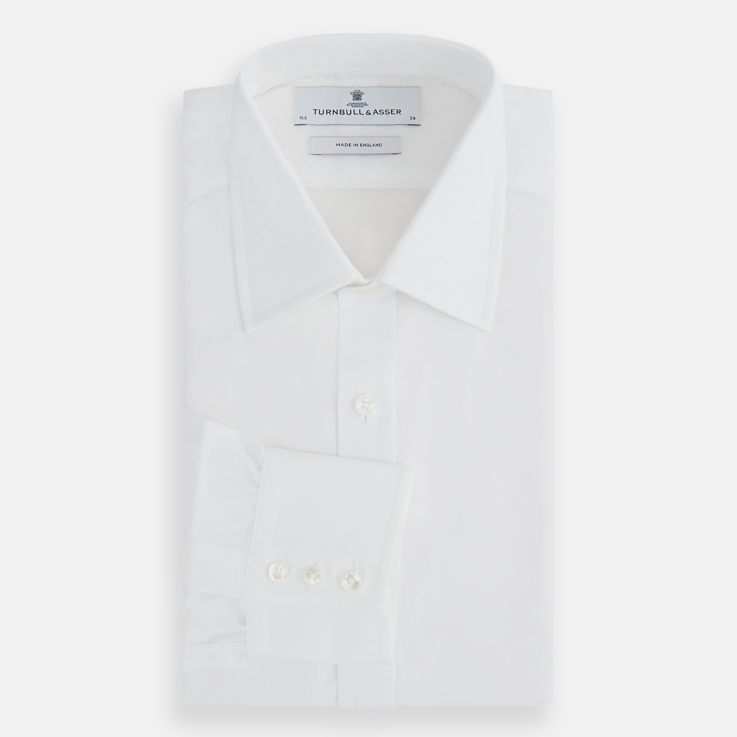 View 5 of product The Turnbull & Asser Plain White Cotton Shirt features a T&A collar, 3-button cuffs, and a timeless minimalist design, shown on a plain white background.