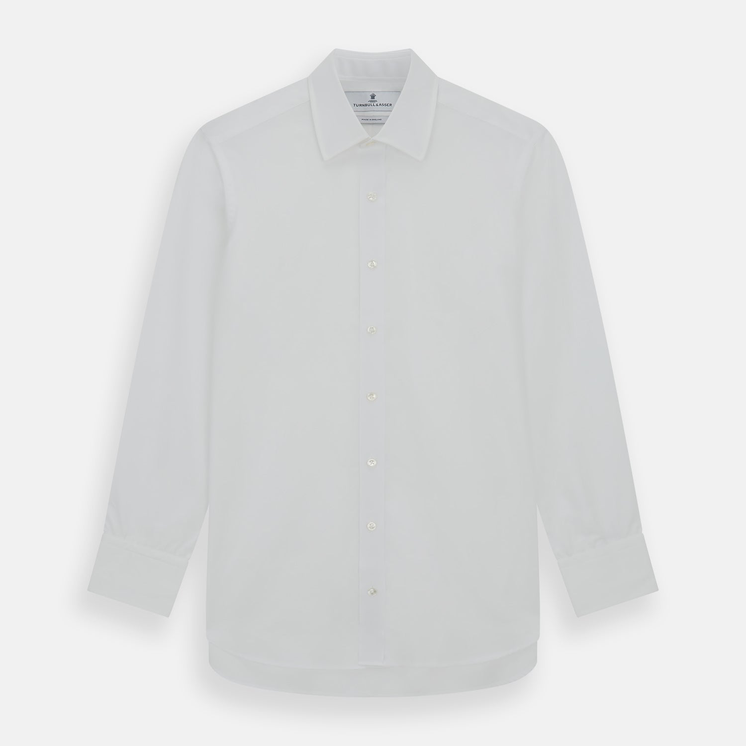 View 1 of product The Turnbull & Asser Plain White Cotton Shirt features a T&A collar, 3-button cuffs, and a timeless minimalist design, shown on a plain white background.
