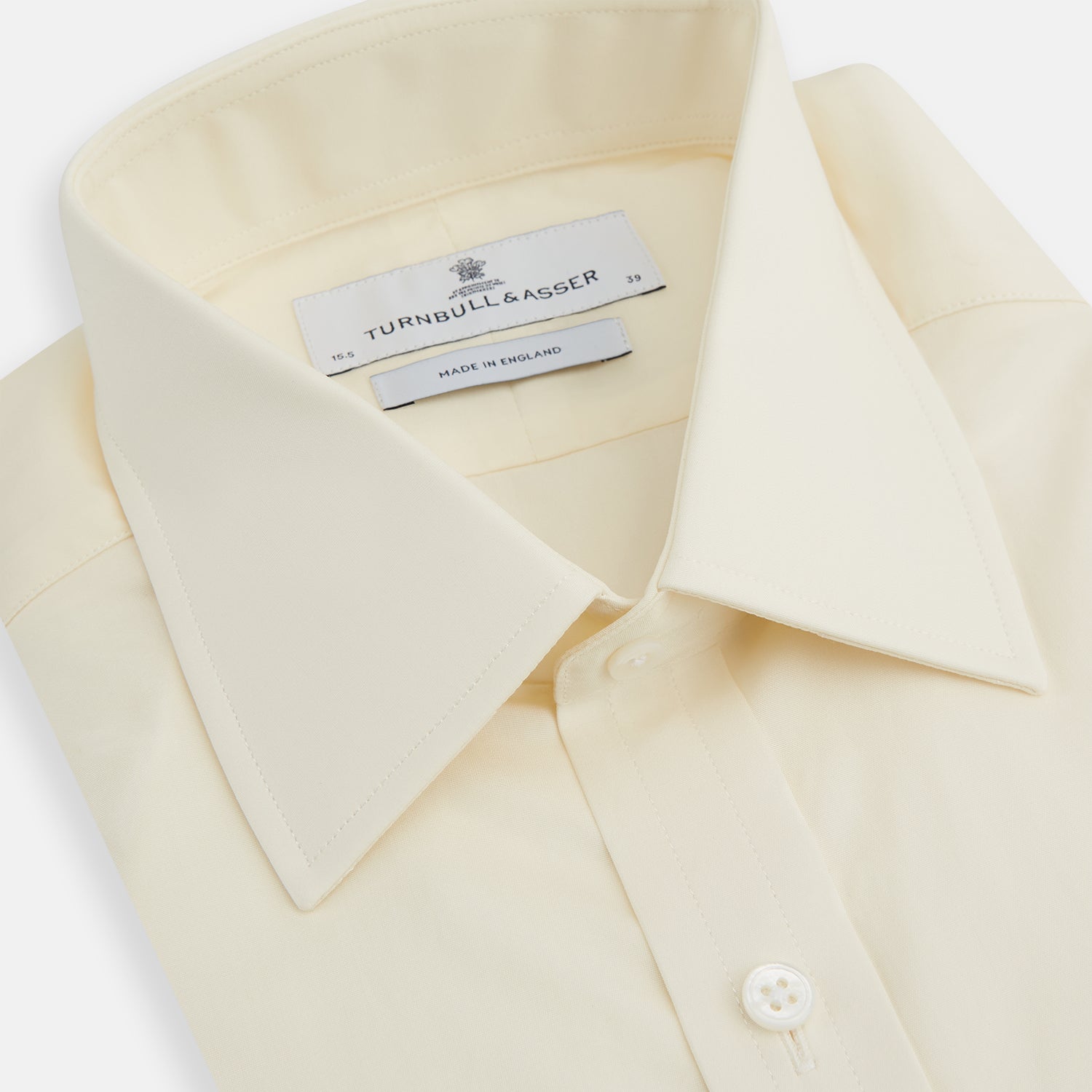 View 2 of product The Turnbull & Asser Cream Cotton Shirt features a T&A collar, button-up front, and 3-button cuffs, displayed on a plain white background.