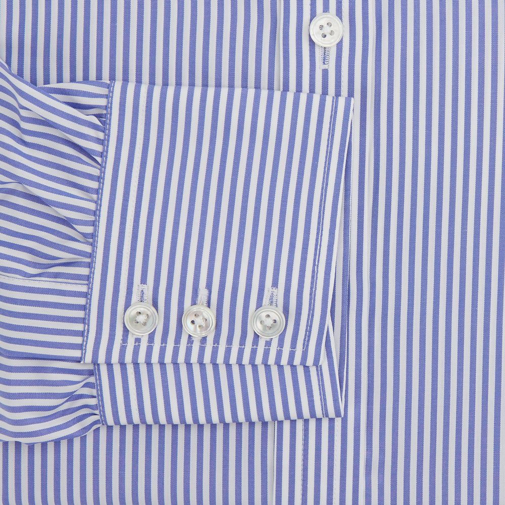 The Turnbull & Asser Blue Bengal Stripe Shirt features a T&A collar, 3-button cuffs, and classic blue and white vertical stripes, shown neatly laid flat against a white background.