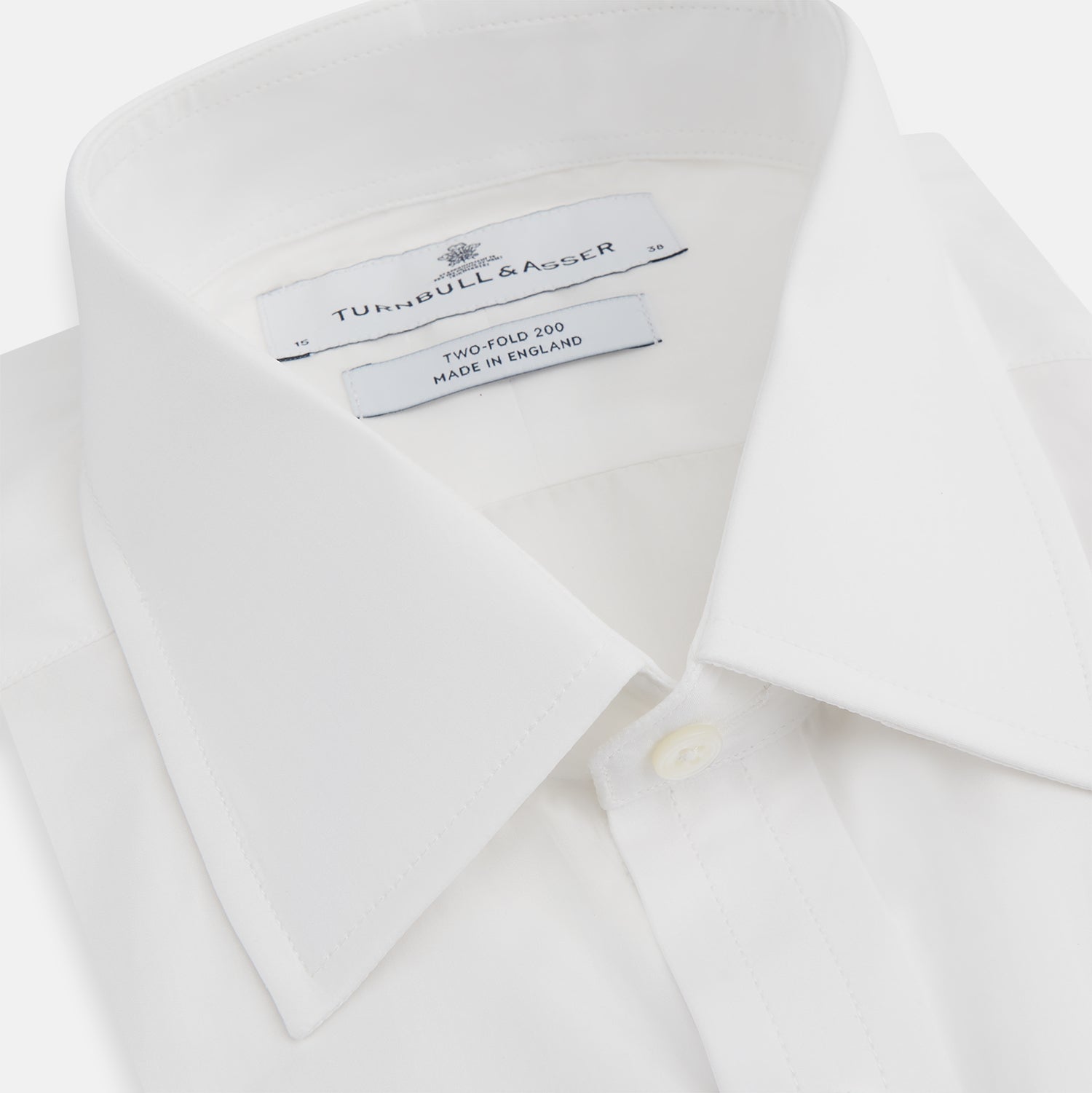 View 2 of product The Turnbull & Asser Two-Fold 200 White Cotton Shirt features a T&A collar and 3-button cuffs, crafted from breathable cotton and shown on a plain white background.