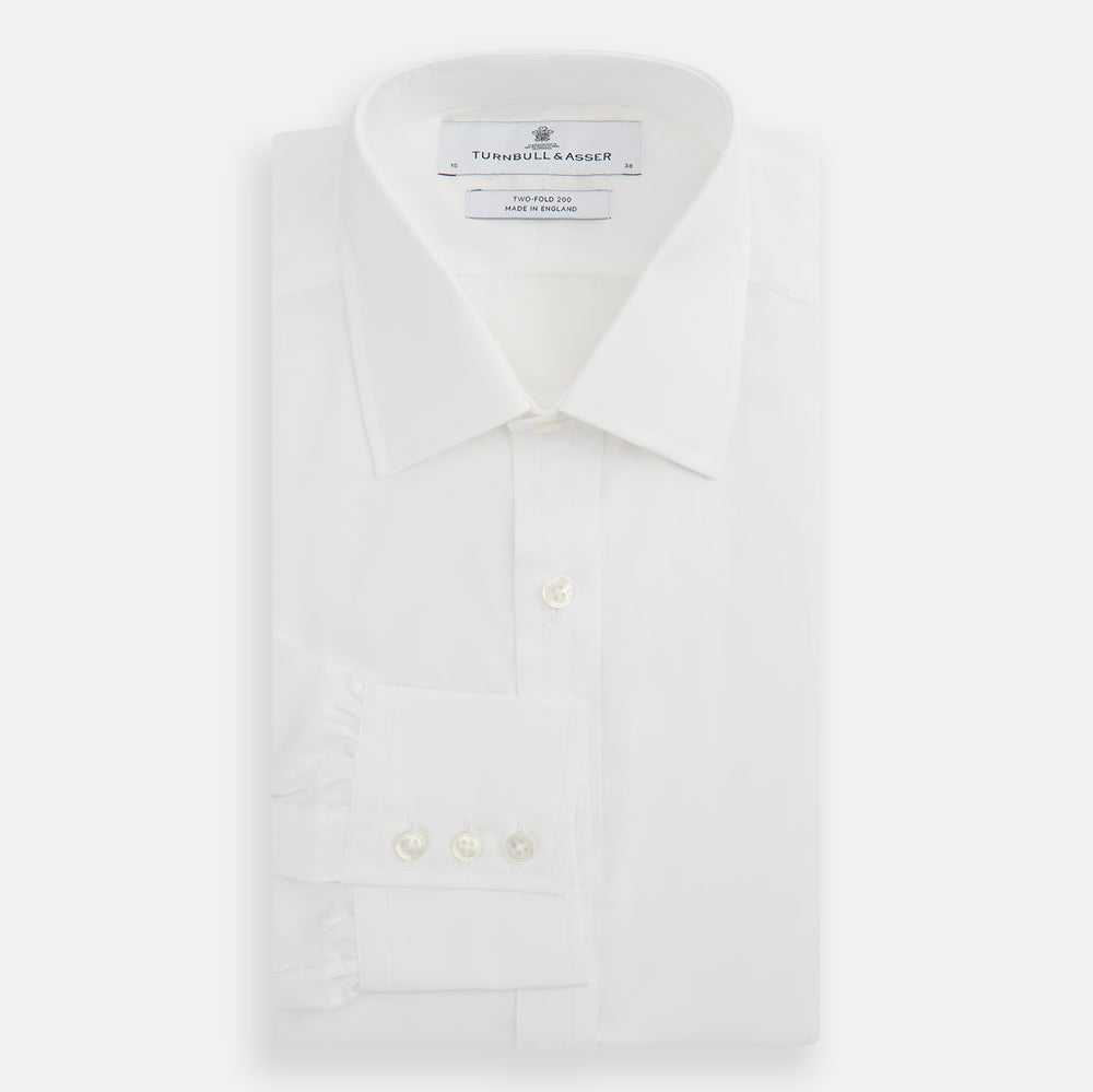 The Turnbull & Asser Two-Fold 200 White Cotton Shirt features a T&A collar and 3-button cuffs, crafted from breathable cotton and shown on a plain white background.