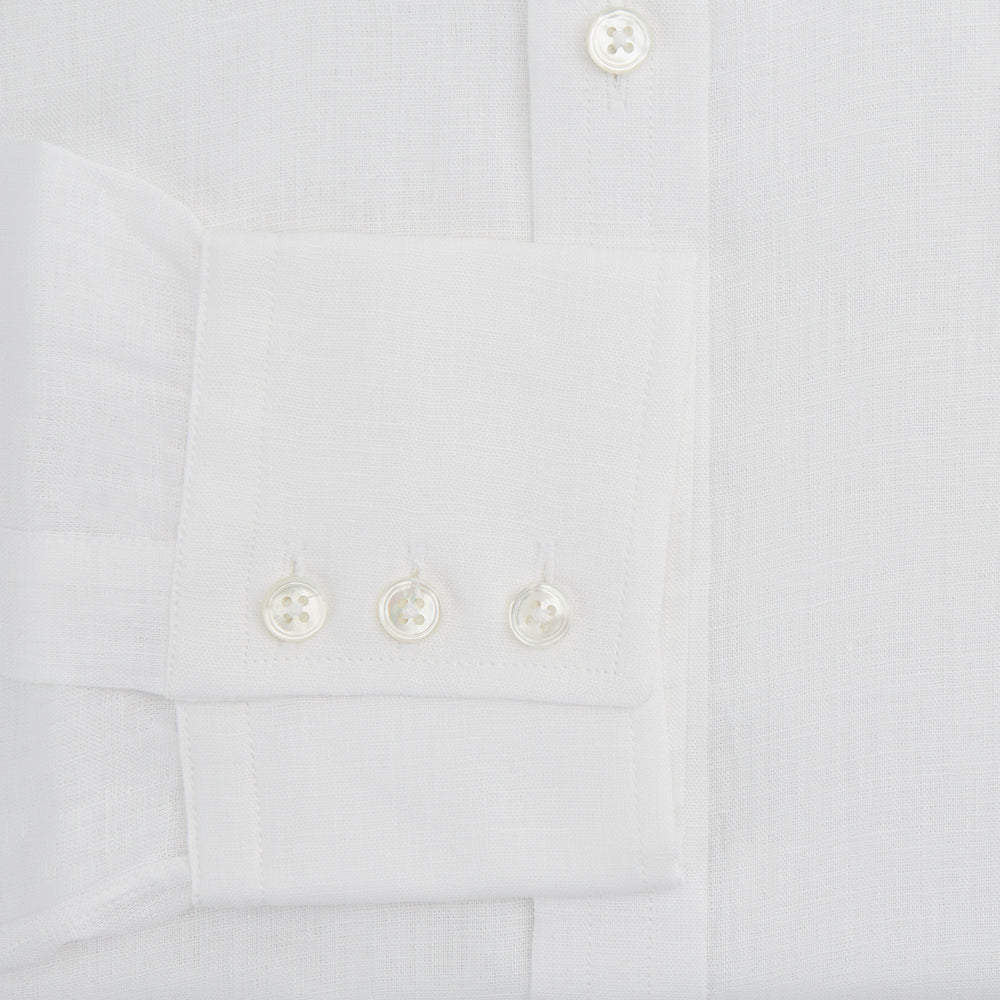 The Turnbull & Asser White Linen Shirt features a T&A collar and 3-button cuffs—an essential summer staple, shown here laid flat on a white background.