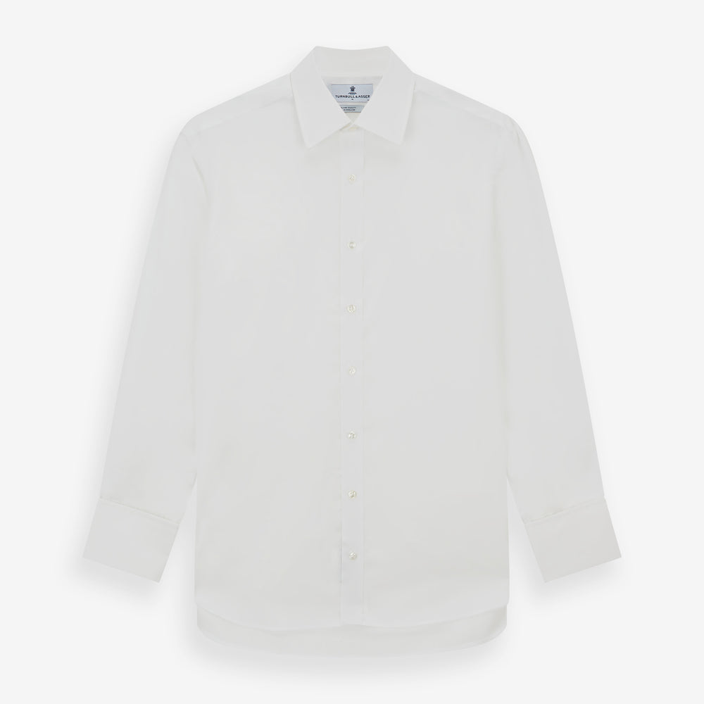 The Turnbull & Asser White Sea Island Quality Cotton Shirt features a T&A collar and double cuffs, crafted from premium cotton and shown laid flat against a white background.