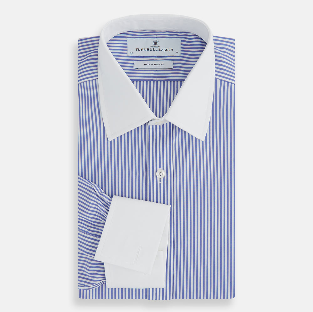The Gekko Shirt with Contrast T&A Collar and Double Cuffs by Turnbull & Asser features blue and white vertical stripes, a white collar, and double cuffs, inspired by the Wall Street film. Displayed on a plain white background.