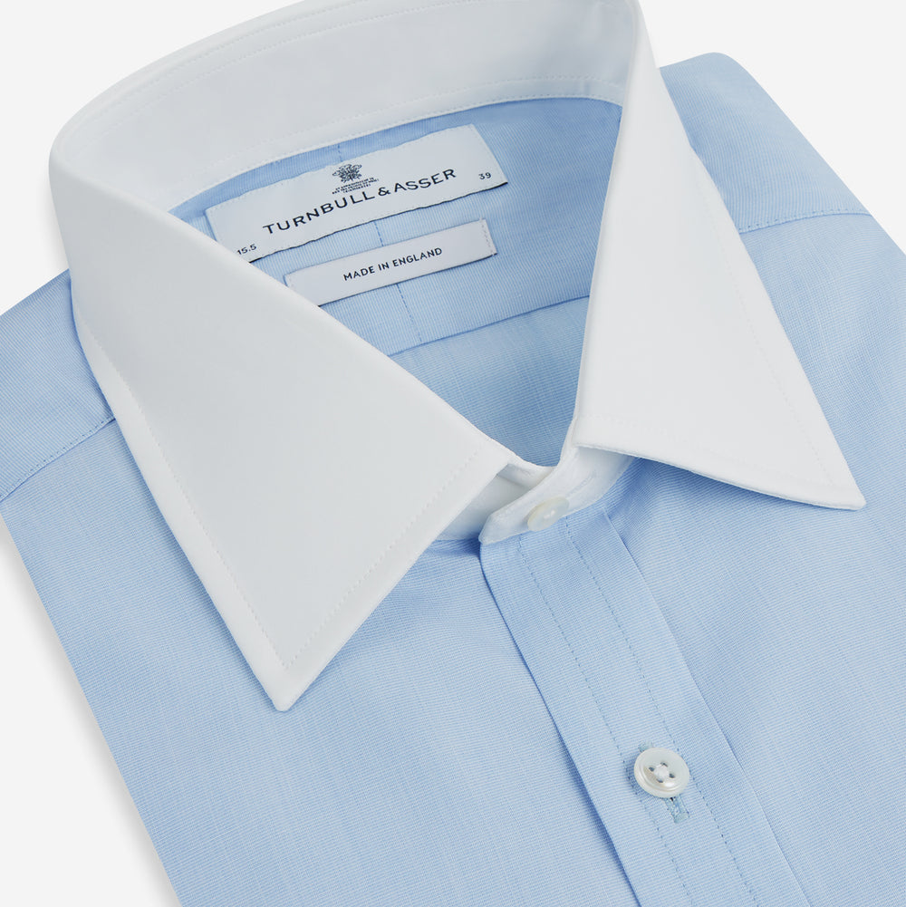 Turnbull & Asser Light Blue End-on-End Shirt features a contrast T&A white collar, double cuffs, long sleeves, and button-down front. Displayed on a plain white background.