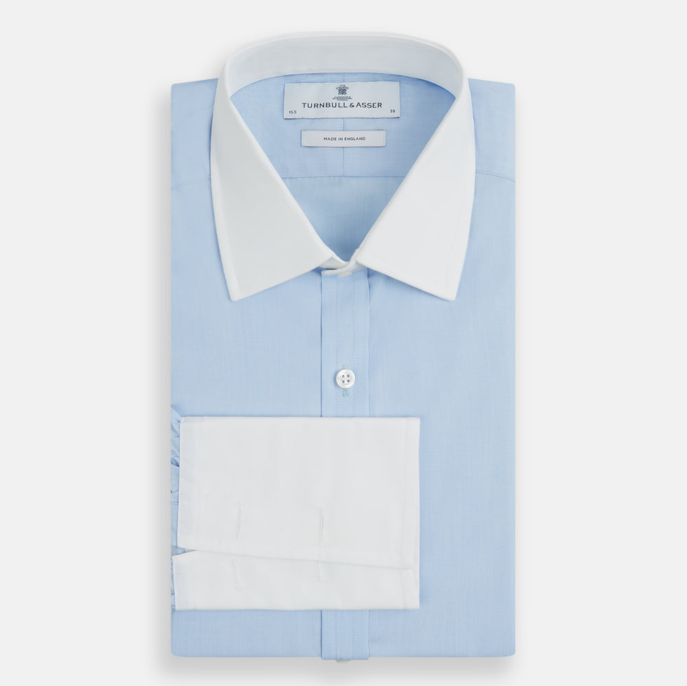 Turnbull & Asser Light Blue End-on-End Shirt features a contrast T&A white collar, double cuffs, long sleeves, and button-down front. Displayed on a plain white background.