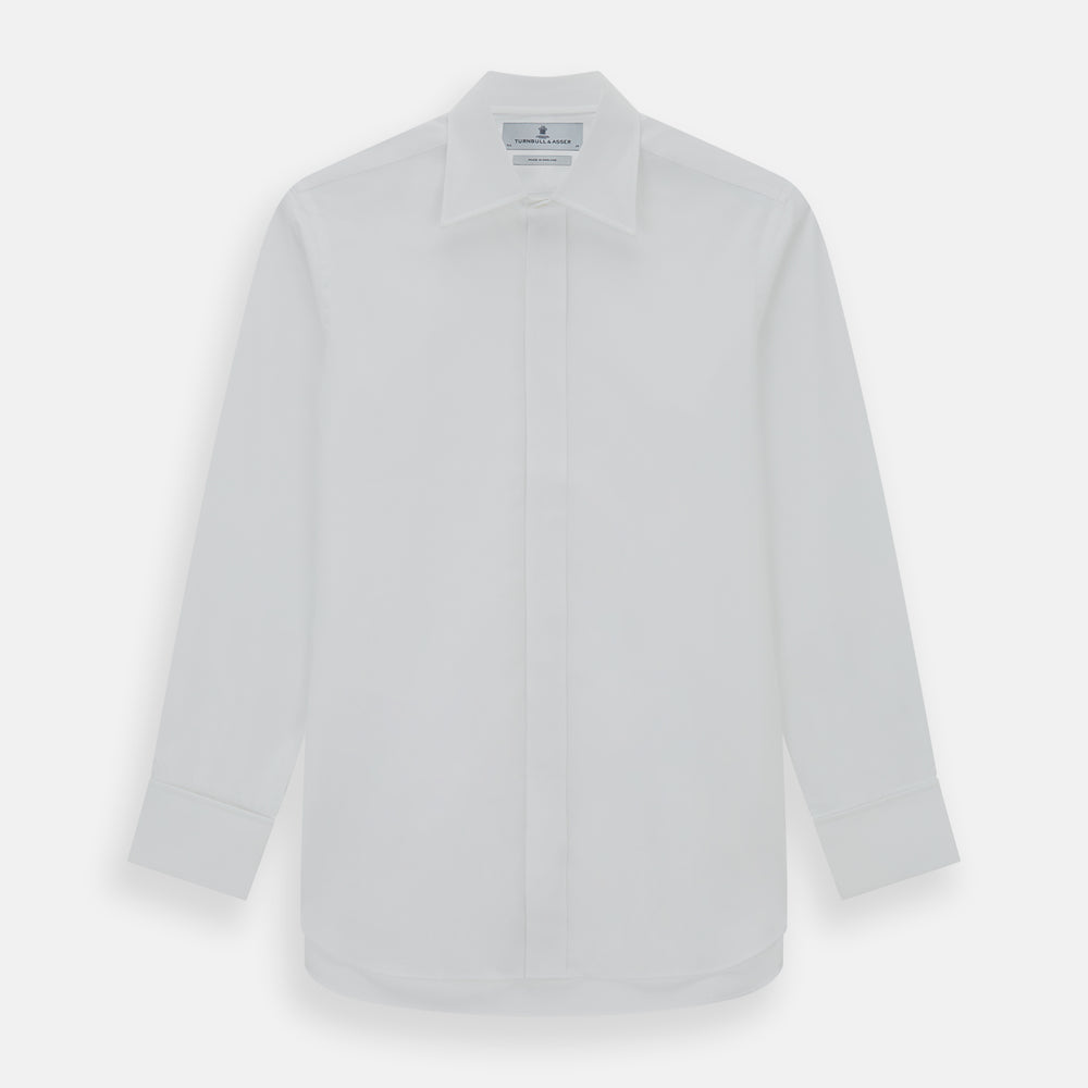 The Turnbull & Asser Casino Royale White Dress Shirt, as seen on James Bond, features long sleeves, a button-down front, and classic collar and cuffs. Displayed against a plain white background.