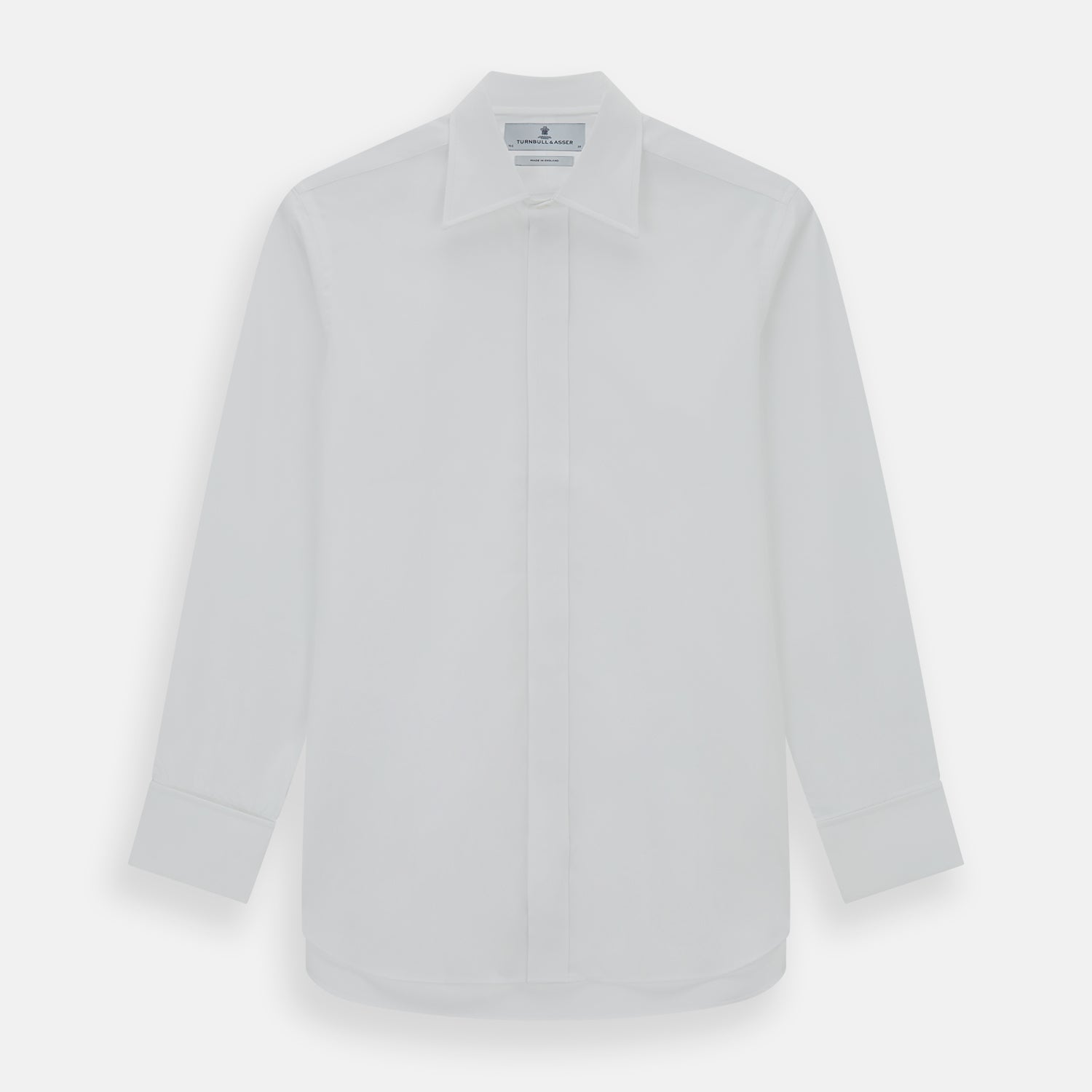 View 1 of product The Turnbull & Asser Casino Royale White Dress Shirt, as seen on James Bond, features long sleeves, a button-down front, and classic collar and cuffs. Displayed against a plain white background.