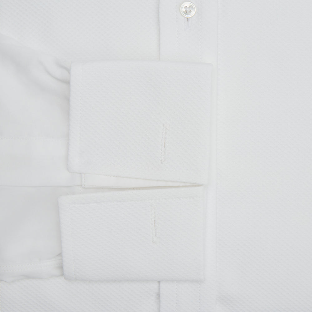The Turnbull & Asser White Cotton Dress Shirt features a wing collar, double cuffs, and is displayed on a plain white background.