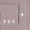 View 4 of product The Turnbull & Asser Burgundy Halo Stripe Winston Shirt features long sleeves, a classic T&A collar, buttoned cuffs, narrow vertical burgundy and white stripes, and is crafted from organic cotton. Displayed on a white background.