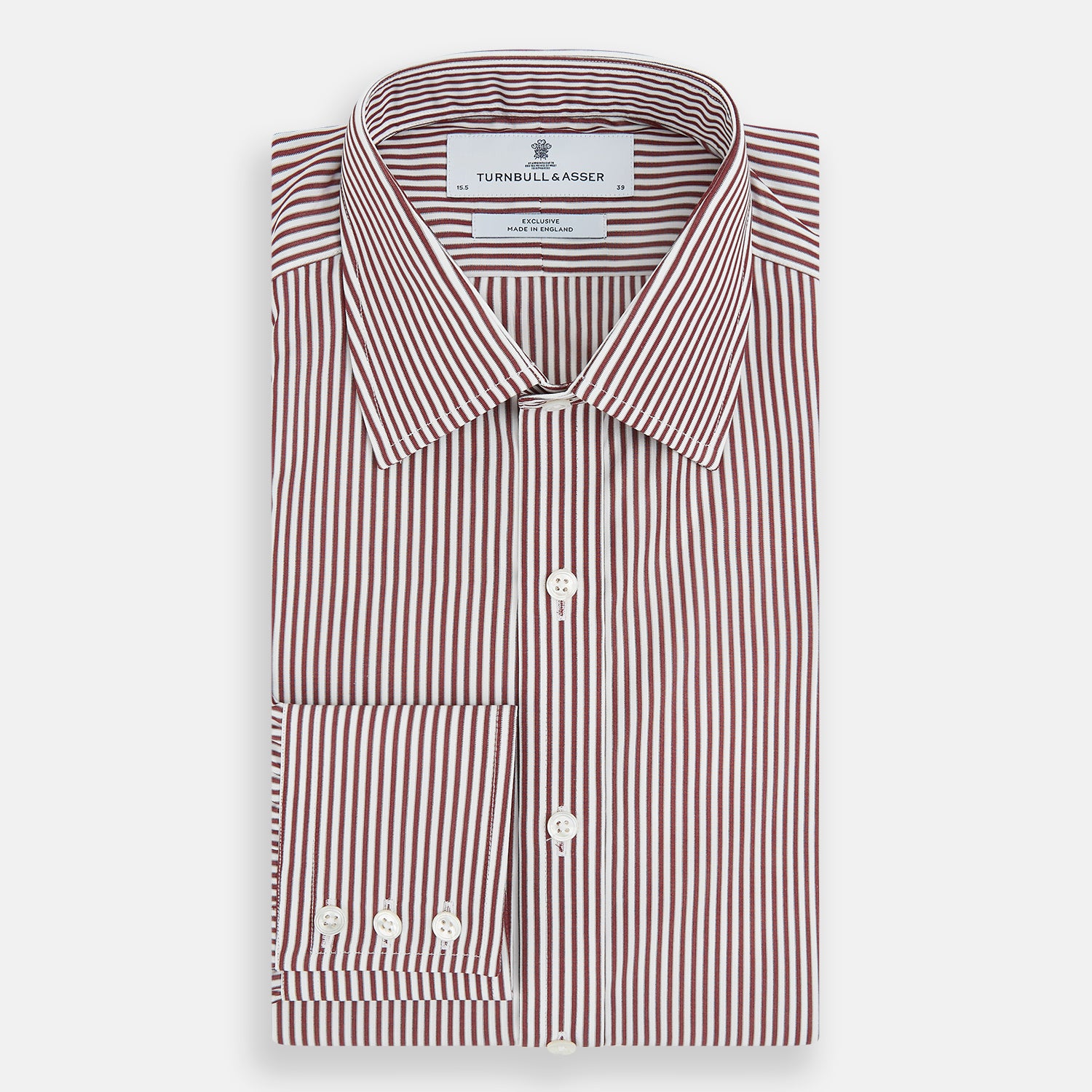 View 5 of product The Turnbull & Asser Burgundy Halo Stripe Winston Shirt features long sleeves, a classic T&A collar, buttoned cuffs, narrow vertical burgundy and white stripes, and is crafted from organic cotton. Displayed on a white background.