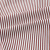 View 6 of product The Turnbull & Asser Burgundy Halo Stripe Winston Shirt features long sleeves, a classic T&A collar, buttoned cuffs, narrow vertical burgundy and white stripes, and is crafted from organic cotton. Displayed on a white background.