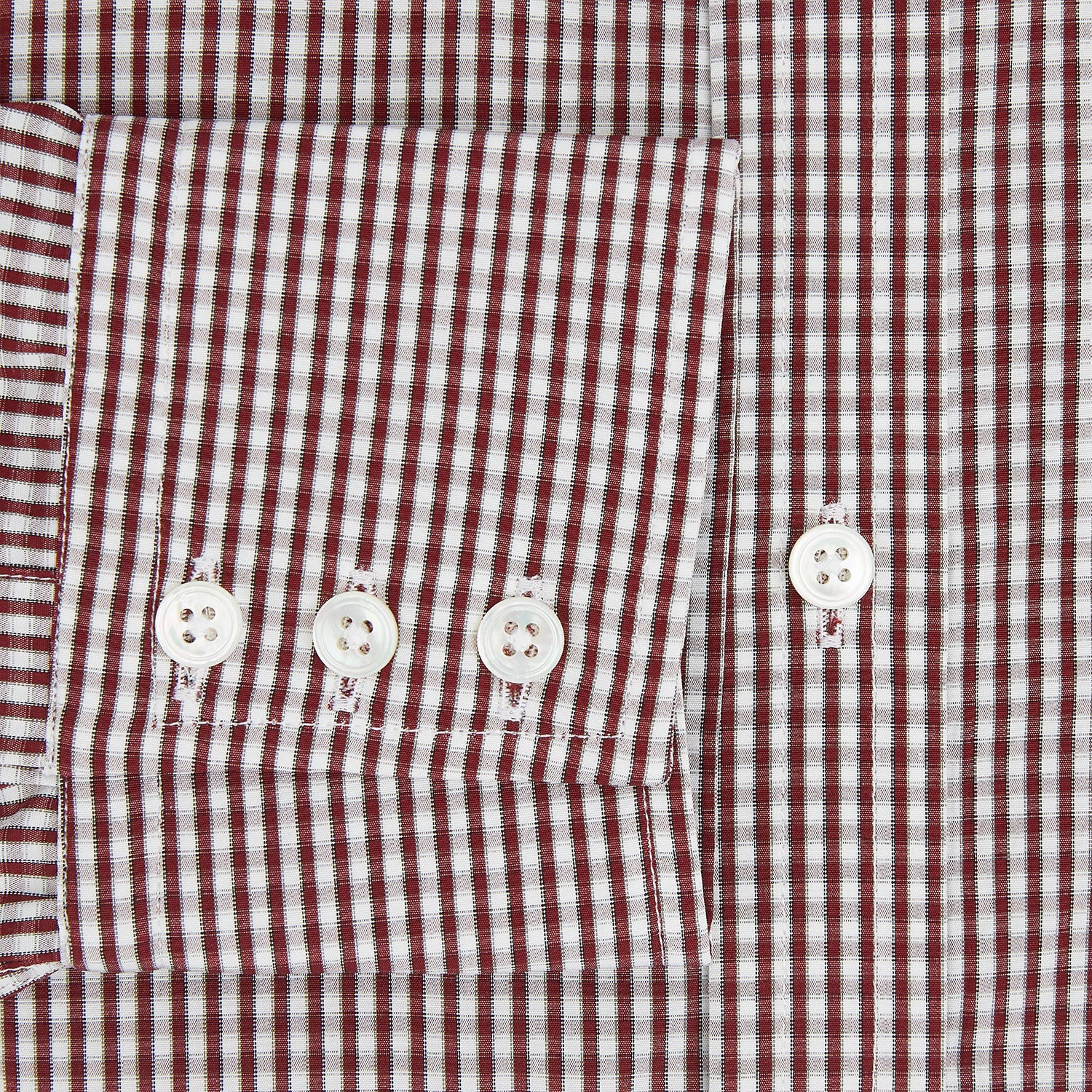 View 4 of product The Turnbull & Asser Burgundy Micro Check Winston Shirt is a long-sleeved, button-up Mayfair fit dress shirt with a collar and buttoned cuffs, featuring a small red and white check pattern and shown on a white background.